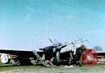 Image of Camouflaged wrecked German Heinkel He-111 airplanes Germany, 1945, second 1 stock footage video 65675020427