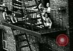 Image of Residents outdoors in their neighborhood Bronx New York City USA, 1965, second 24 stock footage video 65675020823