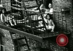 Image of Residents outdoors in their neighborhood Bronx New York City USA, 1965, second 25 stock footage video 65675020823