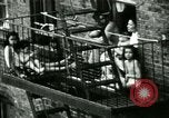 Image of Residents outdoors in their neighborhood Bronx New York City USA, 1965, second 27 stock footage video 65675020823