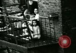 Image of Residents outdoors in their neighborhood Bronx New York City USA, 1965, second 28 stock footage video 65675020823