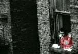 Image of Residents outdoors in their neighborhood Bronx New York City USA, 1965, second 30 stock footage video 65675020823