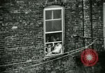 Image of Residents outdoors in their neighborhood Bronx New York City USA, 1965, second 54 stock footage video 65675020823