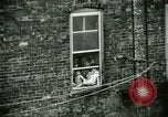 Image of Residents outdoors in their neighborhood Bronx New York City USA, 1965, second 55 stock footage video 65675020823