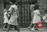 Image of Puerto Rican immigrants go to church and play baseball Bronx New York City USA, 1965, second 42 stock footage video 65675020826