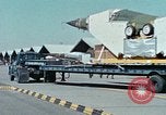 Image of  F-5E Tiger II fighters being loaded on C-5 transport aircraft California United States USA, 1976, second 8 stock footage video 65675021081