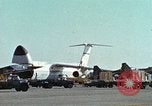 Image of  F-5E Tiger II fighters being loaded on C-5 transport aircraft California United States USA, 1976, second 9 stock footage video 65675021081