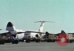 Image of  F-5E Tiger II fighters being loaded on C-5 transport aircraft California United States USA, 1976, second 10 stock footage video 65675021081