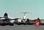 Image of  F-5E Tiger II fighters being loaded on C-5 transport aircraft California United States USA, 1976, second 11 stock footage video 65675021081