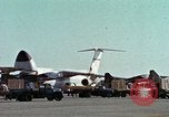 Image of  F-5E Tiger II fighters being loaded on C-5 transport aircraft California United States USA, 1976, second 12 stock footage video 65675021081