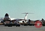 Image of  F-5E Tiger II fighters being loaded on C-5 transport aircraft California United States USA, 1976, second 13 stock footage video 65675021081