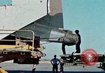 Image of  F-5E Tiger II fighters being loaded on C-5 transport aircraft California United States USA, 1976, second 15 stock footage video 65675021081
