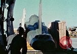 Image of  F-5E Tiger II fighters being loaded on C-5 transport aircraft California United States USA, 1976, second 17 stock footage video 65675021081
