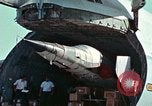 Image of  F-5E Tiger II fighters being loaded on C-5 transport aircraft California United States USA, 1976, second 18 stock footage video 65675021081
