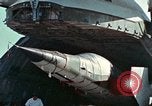 Image of  F-5E Tiger II fighters being loaded on C-5 transport aircraft California United States USA, 1976, second 19 stock footage video 65675021081