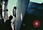 Image of  F-5E Tiger II fighters being loaded on C-5 transport aircraft California United States USA, 1976, second 21 stock footage video 65675021081