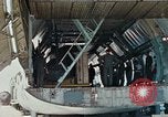 Image of  F-5E Tiger II fighters being loaded on C-5 transport aircraft California United States USA, 1976, second 22 stock footage video 65675021081