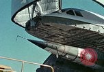 Image of  F-5E Tiger II fighters being loaded on C-5 transport aircraft California United States USA, 1976, second 23 stock footage video 65675021081