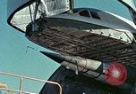 Image of  F-5E Tiger II fighters being loaded on C-5 transport aircraft California United States USA, 1976, second 24 stock footage video 65675021081