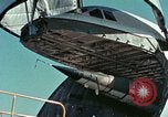 Image of  F-5E Tiger II fighters being loaded on C-5 transport aircraft California United States USA, 1976, second 25 stock footage video 65675021081