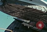 Image of  F-5E Tiger II fighters being loaded on C-5 transport aircraft California United States USA, 1976, second 26 stock footage video 65675021081