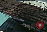 Image of  F-5E Tiger II fighters being loaded on C-5 transport aircraft California United States USA, 1976, second 27 stock footage video 65675021081