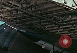 Image of  F-5E Tiger II fighters being loaded on C-5 transport aircraft California United States USA, 1976, second 28 stock footage video 65675021081
