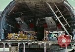 Image of  F-5E Tiger II fighters being loaded on C-5 transport aircraft California United States USA, 1976, second 29 stock footage video 65675021081