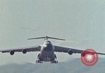 Image of  F-5E Tiger II fighters being loaded on C-5 transport aircraft California United States USA, 1976, second 40 stock footage video 65675021081