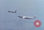 Image of  F-5E Tiger II fighters being loaded on C-5 transport aircraft California United States USA, 1976, second 41 stock footage video 65675021081