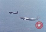 Image of  F-5E Tiger II fighters being loaded on C-5 transport aircraft California United States USA, 1976, second 42 stock footage video 65675021081