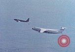Image of  F-5E Tiger II fighters being loaded on C-5 transport aircraft California United States USA, 1976, second 45 stock footage video 65675021081