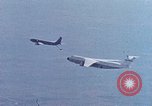 Image of  F-5E Tiger II fighters being loaded on C-5 transport aircraft California United States USA, 1976, second 46 stock footage video 65675021081