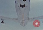 Image of  F-5E Tiger II fighters being loaded on C-5 transport aircraft California United States USA, 1976, second 53 stock footage video 65675021081