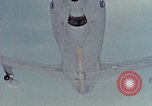 Image of  F-5E Tiger II fighters being loaded on C-5 transport aircraft California United States USA, 1976, second 54 stock footage video 65675021081