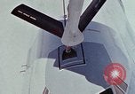 Image of  F-5E Tiger II fighters being loaded on C-5 transport aircraft California United States USA, 1976, second 60 stock footage video 65675021081