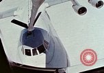 Image of  F-5E Tiger II fighters being loaded on C-5 transport aircraft California United States USA, 1976, second 62 stock footage video 65675021081