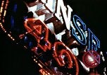 Image of Times Square neon lights in rain New York City USA, 1954, second 26 stock footage video 65675021110