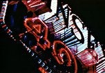 Image of Times Square neon lights in rain New York City USA, 1954, second 30 stock footage video 65675021110