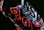 Image of Times Square neon lights in rain New York City USA, 1954, second 31 stock footage video 65675021110