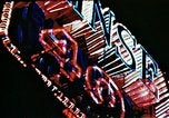Image of Times Square neon lights in rain New York City USA, 1954, second 32 stock footage video 65675021110