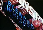 Image of Times Square neon lights in rain New York City USA, 1954, second 33 stock footage video 65675021110