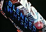 Image of Times Square neon lights in rain New York City USA, 1954, second 34 stock footage video 65675021110