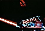 Image of Times Square neon lights in rain New York City USA, 1954, second 36 stock footage video 65675021110