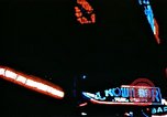 Image of Times Square neon lights in rain New York City USA, 1954, second 39 stock footage video 65675021110
