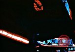 Image of Times Square neon lights in rain New York City USA, 1954, second 41 stock footage video 65675021110