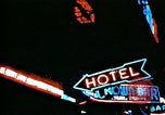 Image of Times Square neon lights in rain New York City USA, 1954, second 42 stock footage video 65675021110