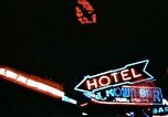 Image of Times Square neon lights in rain New York City USA, 1954, second 44 stock footage video 65675021110