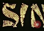 Image of Times Square neon lights in rain New York City USA, 1954, second 46 stock footage video 65675021110