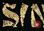 Image of Times Square neon lights in rain New York City USA, 1954, second 48 stock footage video 65675021110